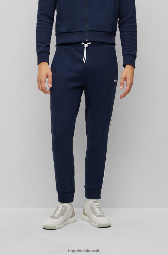 4TFNJN1043 أزرق غامق Hugo Boss بدلة رياضية بشعار Hugo باللون الأزرق الداكن ومصنوعة من القطن ذو وجهين