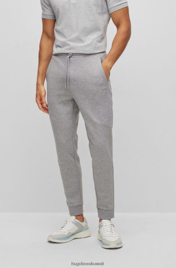 4TFNJN1136 رمادي فاتح Hugo Boss بدلة رياضية من مزيج القطن باللون الرمادي الفاتح مع عمل فني شبكي