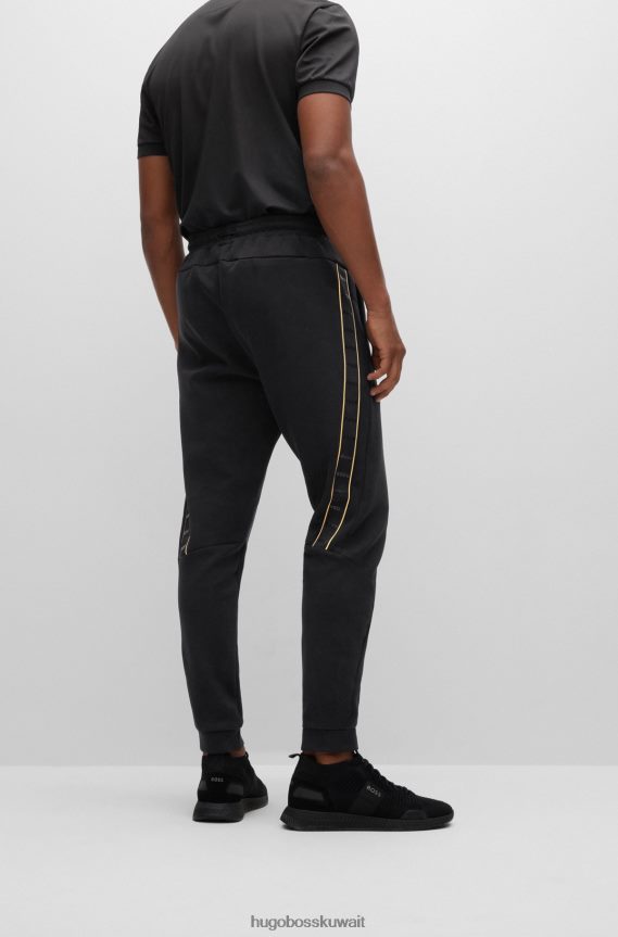 4TFNJN1286 أسود Hugo Boss بدلة رياضية من مزيج القطن من Hugo باللون الأسود مع شريط الشعار