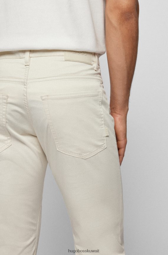 4TFNJN1433 البيج الفاتح Hugo Boss بنطال جينز بقصّة ضيّقة مصنوع من قماش الدنيم المصنوع من قطن الساتان المطاطي باللون البيج الفاتح