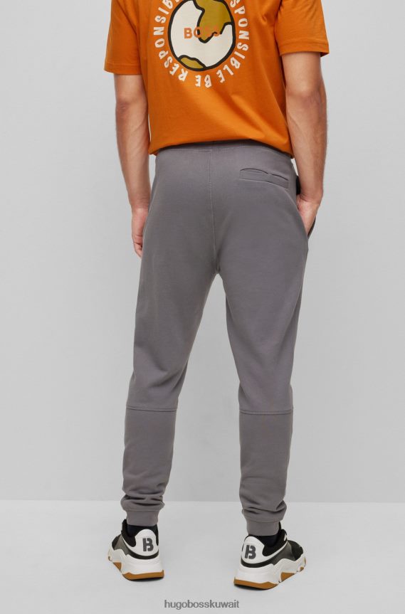 4TFNJN1434 رمادي Hugo Boss بدلة رياضية من قطن تيري باللون الرمادي مع رقعة شعار هوغو