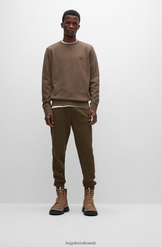 4TFNJN1437 أخضر غامق Hugo Boss بدلة رياضية من Hugo مصنوعة من قطن تيري باللون الأخضر الداكن مع رقعة الشعار