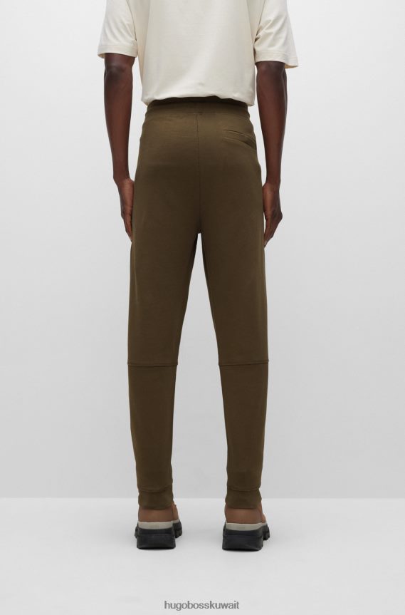 4TFNJN1437 أخضر غامق Hugo Boss بدلة رياضية من Hugo مصنوعة من قطن تيري باللون الأخضر الداكن مع رقعة الشعار