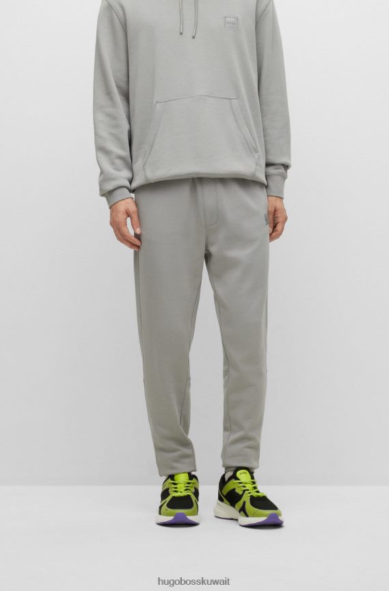 4TFNJN1438 رمادي Hugo Boss سروال رياضي من Hugo مصنوع من قطن تيري مع رقعة شعار باللون الرمادي