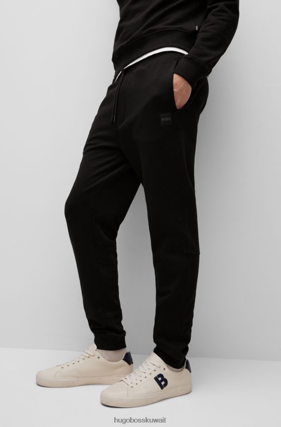 4TFNJN1440 أسود Hugo Boss بدلة رياضية من قطن تيري باللون الأسود مع رقعة شعار هوغو