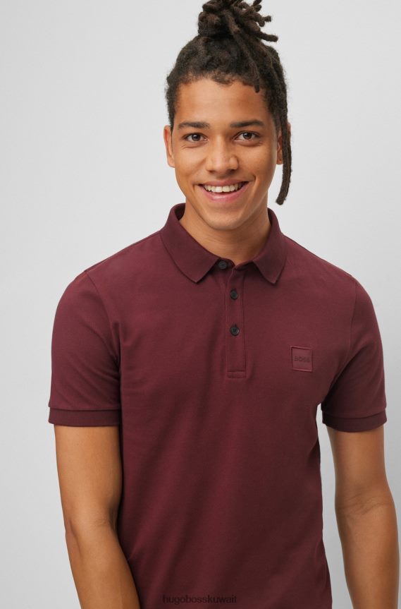 4TFNJN1616 احمر غامق Hugo Boss قميص بولو من القطن المطاطي بقصة ضيقة مع رقعة شعار هوغو باللون الأحمر الداكن