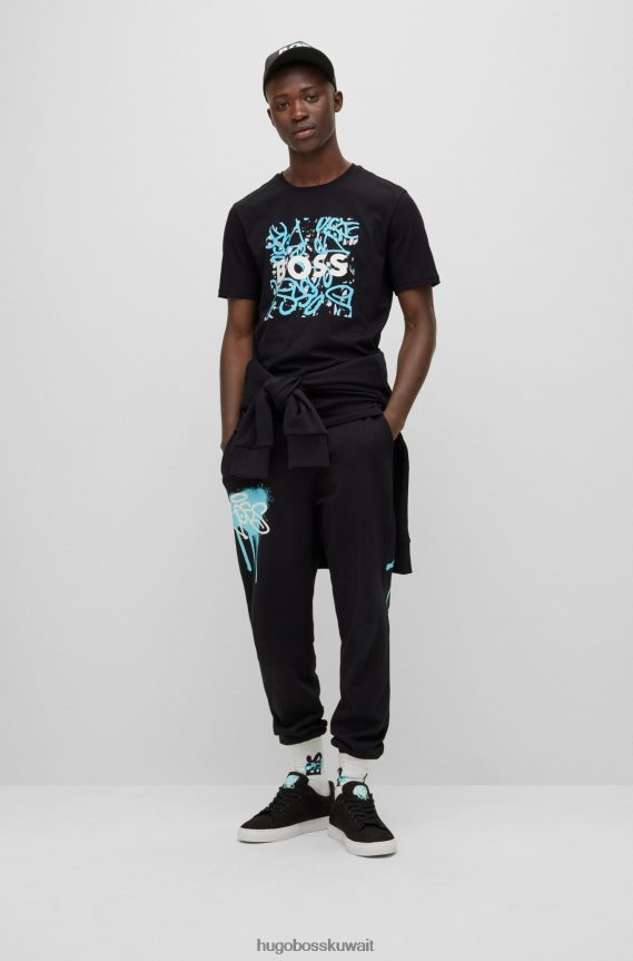 4TFNJN1690 أسود Hugo Boss تي شيرت هوغو من الجيرسي القطني باللون الأسود مع شعار وأعمال فنية على الجدران