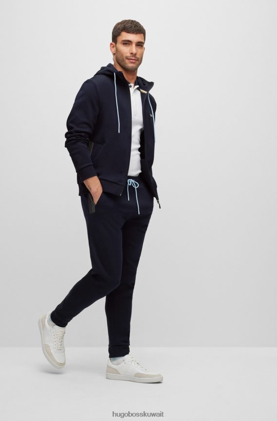 4TFNJN1732 أزرق غامق Hugo Boss بدلة رياضية من مزيج القطن باللون الأزرق الداكن من Hugo مع تفاصيل مخططة متعددة الألوان