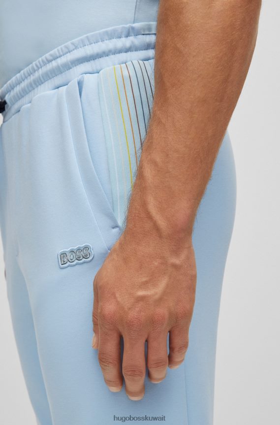 4TFNJN1733 أزرق فاتح Hugo Boss قطعة سفلية من بدلة رياضية من مزيج القطن من Hugo مع تفاصيل مخططة متعددة الألوان باللون الأزرق الفاتح