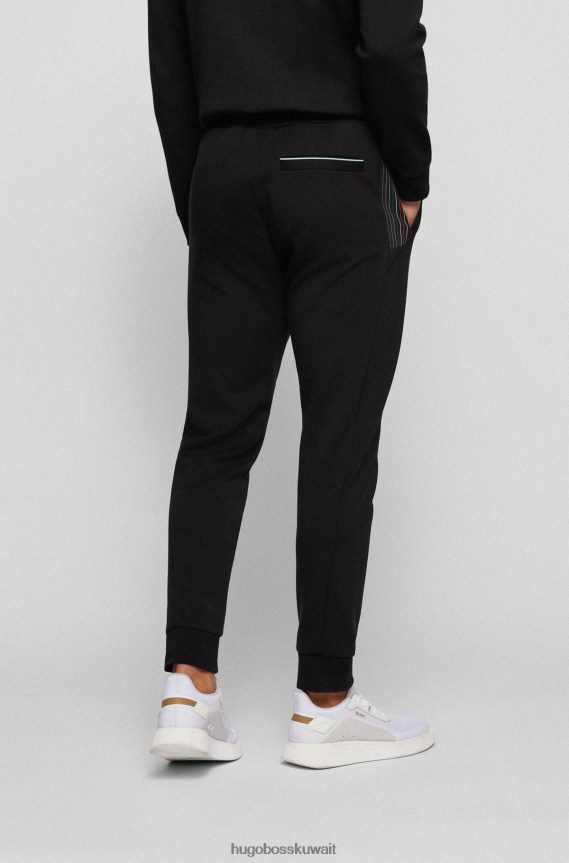 4TFNJN1734 أسود Hugo Boss بدلة رياضية من مزيج القطن مع تفاصيل مخططة متعددة الألوان باللون الأسود من Hugo