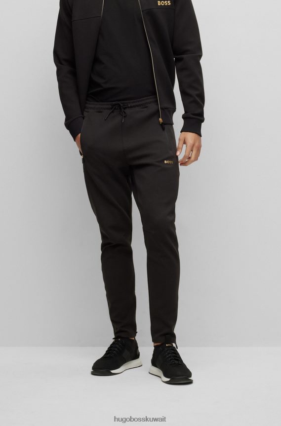 4TFNJN1741 أسود Hugo Boss بدلة رياضية سوداء بحاشية بسحاب مع تفاصيل مثقبة من Hugo