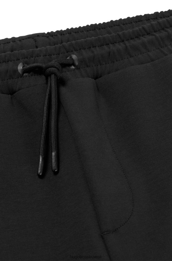 4TFNJN1741 أسود Hugo Boss بدلة رياضية سوداء بحاشية بسحاب مع تفاصيل مثقبة من Hugo