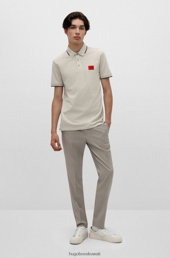 4TFNJN1811 البيج الفاتح Hugo Boss قميص بولو بقصة ضيقة من قطن بيكيه © باللون البيج الفاتح مع شعار هوغو باللون الأحمر