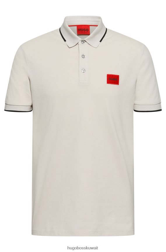 4TFNJN1811 البيج الفاتح Hugo Boss قميص بولو بقصة ضيقة من قطن بيكيه © باللون البيج الفاتح مع شعار هوغو باللون الأحمر