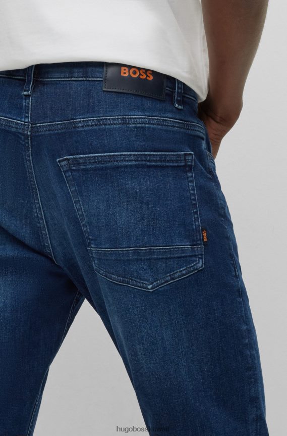 4TFNJN1839 أزرق غامق Hugo Boss جينز هوغو ذو قصة ضيقة باللون الأزرق الداكن من قماش الدنيم ذو الحركة الفائقة باللون الأزرق الداكن