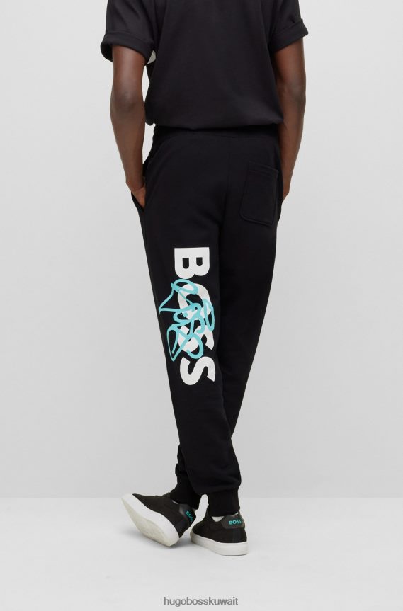 4TFNJN1904 أسود Hugo Boss قطعة سفلية رياضية من Hugo باللون الأسود مريحة مع أعمال فنية على الجدران