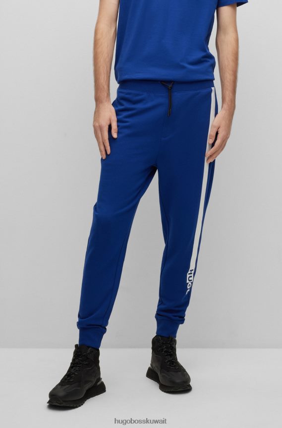 4TFNJN1953 أزرق Hugo Boss بدلة رياضية من قطن تيري مع شعار عمل فني باللون الأزرق هوغو