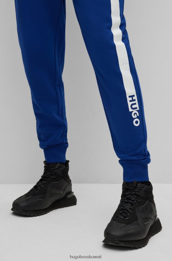 4TFNJN1953 أزرق Hugo Boss بدلة رياضية من قطن تيري مع شعار عمل فني باللون الأزرق هوغو