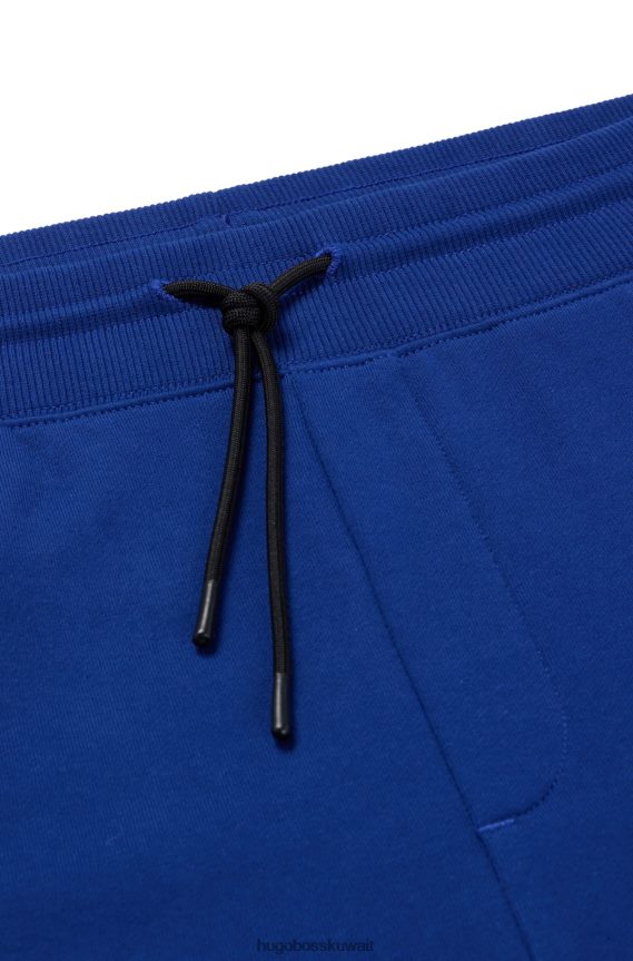 4TFNJN1953 أزرق Hugo Boss بدلة رياضية من قطن تيري مع شعار عمل فني باللون الأزرق هوغو