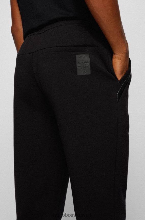 4TFNJN202 أسود/أبيض Hugo Boss بنطال رياضي هالبوا AJ 50456414 أسود