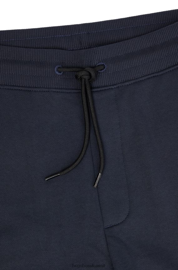 4TFNJN2079 أزرق غامق Hugo Boss سروال رياضي من القطن من Hugo مع رقعة شعار حمراء باللون الأزرق الداكن