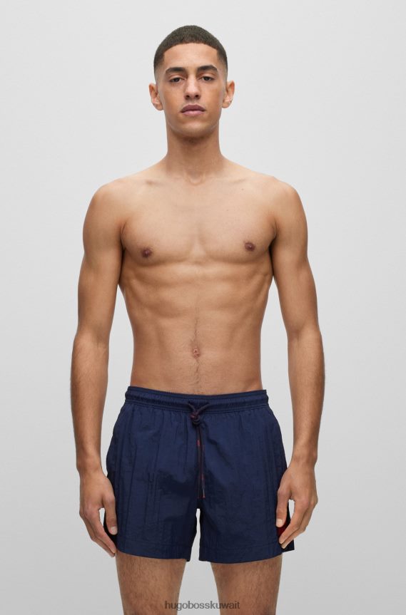 4TFNJN2137 أزرق غامق Hugo Boss شورت سباحة أزرق داكن سريع الجفاف مع شعار هوغو باللون الأحمر