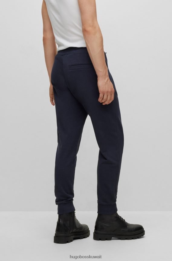 4TFNJN2165 أزرق غامق Hugo Boss بدلة رياضية من Hugo بتصميم مريح من قطن تيري مع جيب كارجو باللون الأزرق الداكن