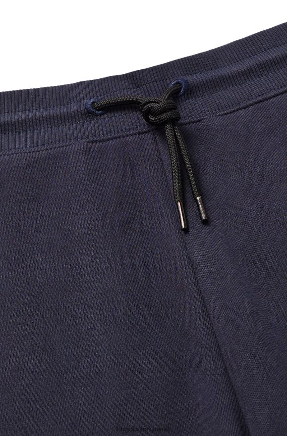 4TFNJN2165 أزرق غامق Hugo Boss بدلة رياضية من Hugo بتصميم مريح من قطن تيري مع جيب كارجو باللون الأزرق الداكن