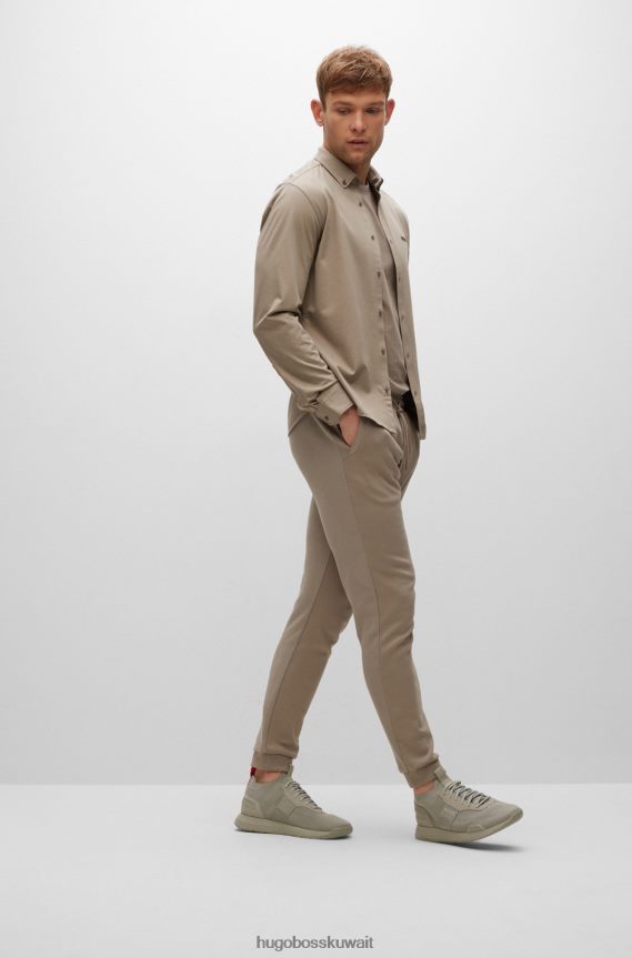 4TFNJN2190 اخضر فاتح Hugo Boss قميص Hugo ذو المقاس العادي مصنوع من مزيج القطن الجيرسي الممتص للرطوبة باللون الأخضر الفاتح