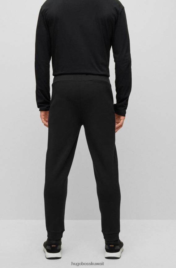 4TFNJN2237 أسود Hugo Boss بدلة رياضية من مزيج القطن من Hugo باللون الأسود مع شعار معدني