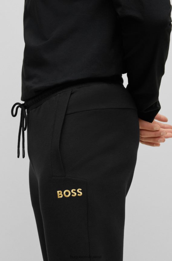 4TFNJN2237 أسود Hugo Boss بدلة رياضية من مزيج القطن من Hugo باللون الأسود مع شعار معدني