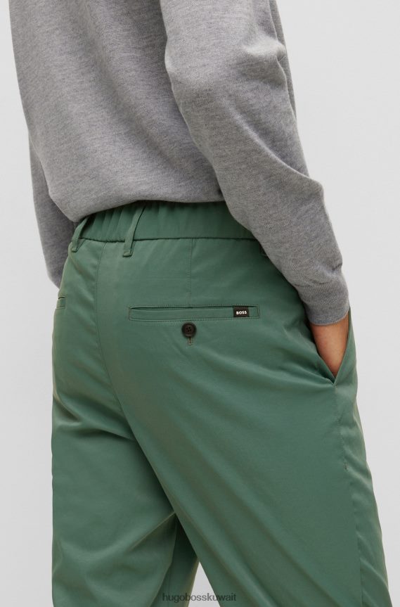 4TFNJN2358 أخضر Hugo Boss بنطال مستدق باللون الأخضر مع ساق قصيرة مصنوع من قماش هوغو عالي الأداء