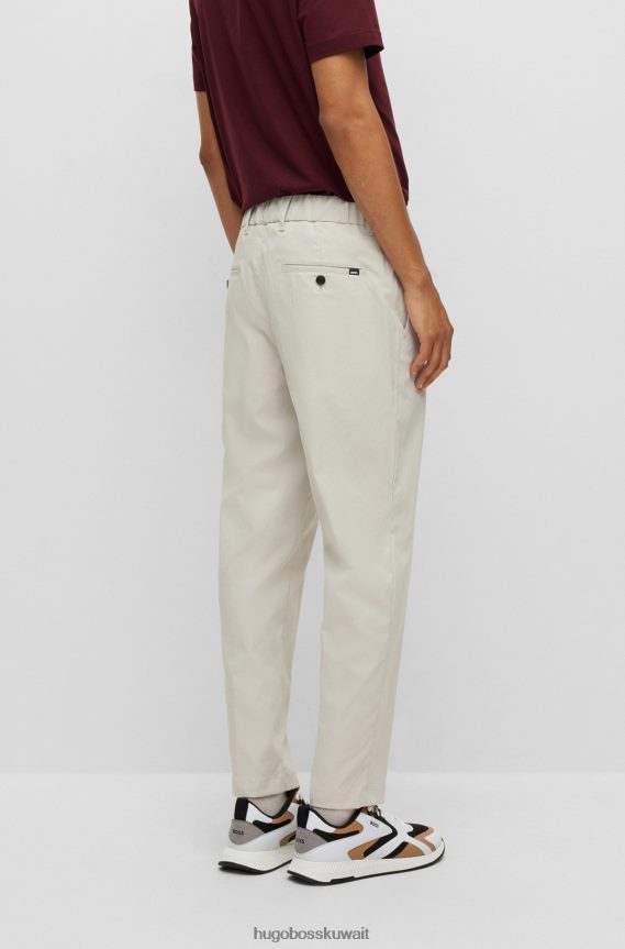 4TFNJN2359 اللون البيج Hugo Boss بنطال بقصّة مدببة وساق قصيرة مصنوع من قماش هوغو بيج عالي الأداء