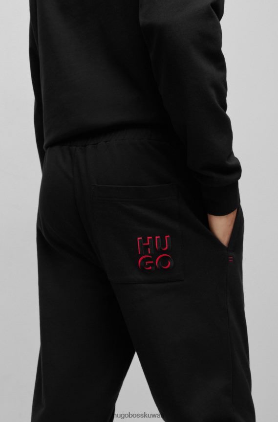 4TFNJN2474 أسود Hugo Boss سروال رياضي من Hugo مصنوع من قطن تيري مع شعار مكدس باللون الأسود