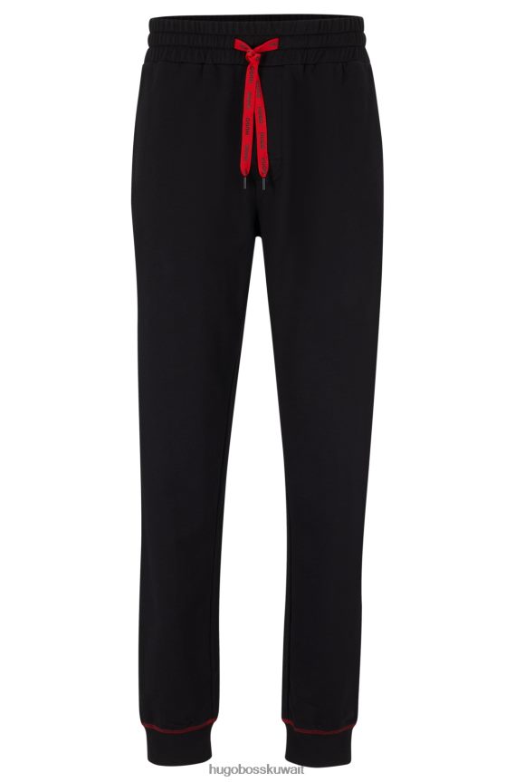 4TFNJN2474 أسود Hugo Boss سروال رياضي من Hugo مصنوع من قطن تيري مع شعار مكدس باللون الأسود
