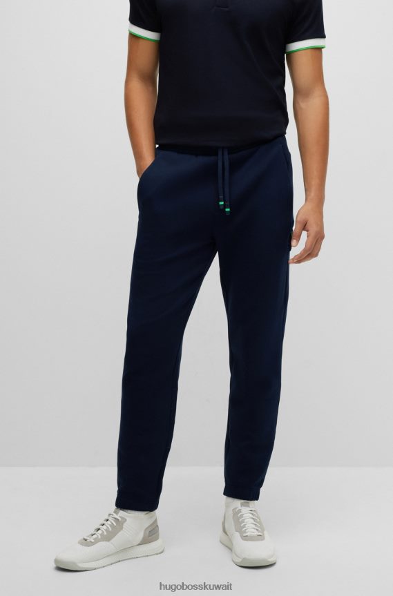 4TFNJN2480 أزرق غامق Hugo Boss هوغو بدلة رياضية من مزيج القطن باللون الأزرق الداكن مع تطريز الشعار