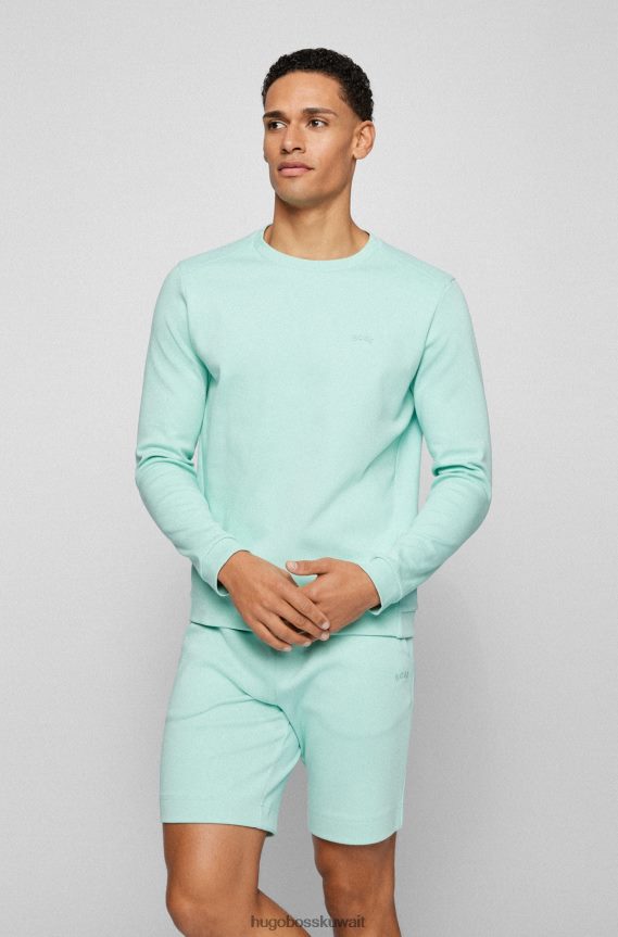 4TFNJN2517 اخضر فاتح Hugo Boss سويت شيرت هوغو برقبة دائرية باللون الأخضر الفاتح من القطن المتشابك مع شعار منحني