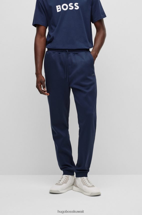 4TFNJN2533 أزرق غامق Hugo Boss بدلة رياضية من القطن باللون الأزرق الداكن مع شعار Hugo المنحني