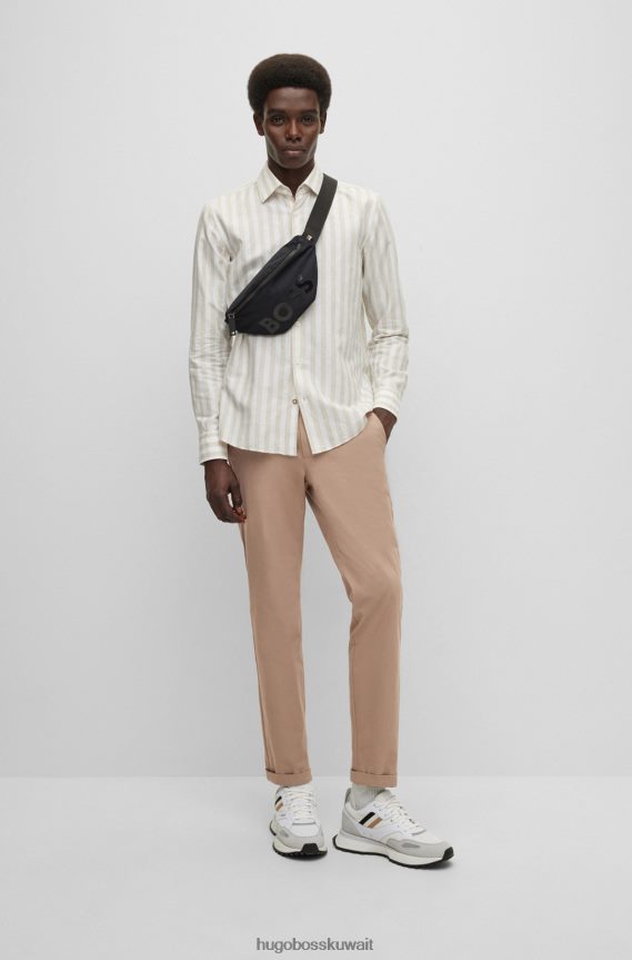 4TFNJN2556 البيج الفاتح Hugo Boss بنطلون هوغو ذو قصة ضيقة باللون البيج الفاتح مع طيات أمامية من مزيج القطن