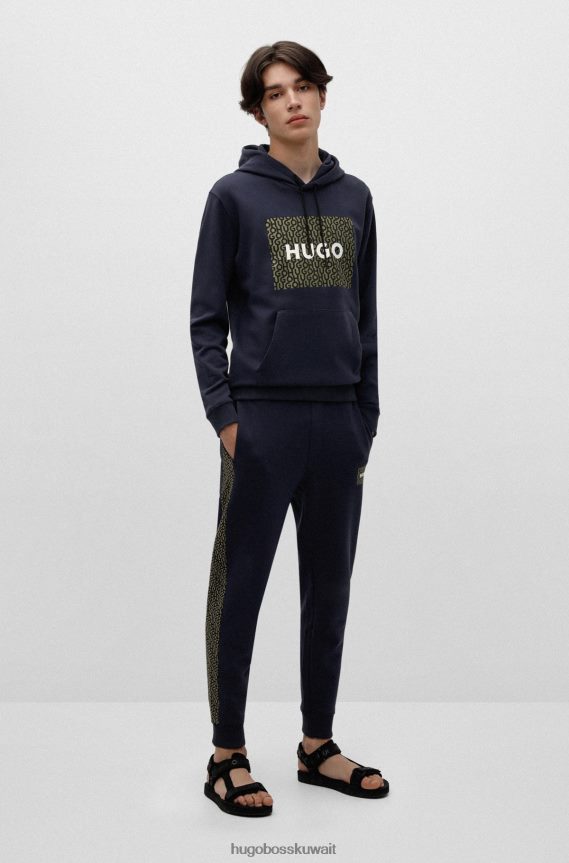 4TFNJN2571 أزرق غامق Hugo Boss بدلة رياضية من قطن تيري باللون الأزرق الداكن مع رقعة شعار وإدخالات هوغو