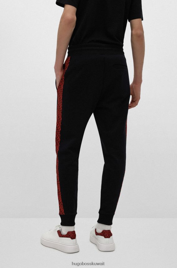 4TFNJN2573 أسود Hugo Boss بدلة رياضية سوداء من Hugo مصنوعة من قطن تيري مع رقعة شعار وإدخالات