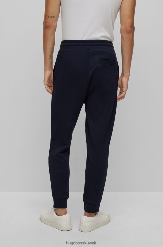 4TFNJN2576 أزرق غامق Hugo Boss بدلة رياضية من قطن تيري مع تفاصيل الشعار باللون الأزرق الداكن