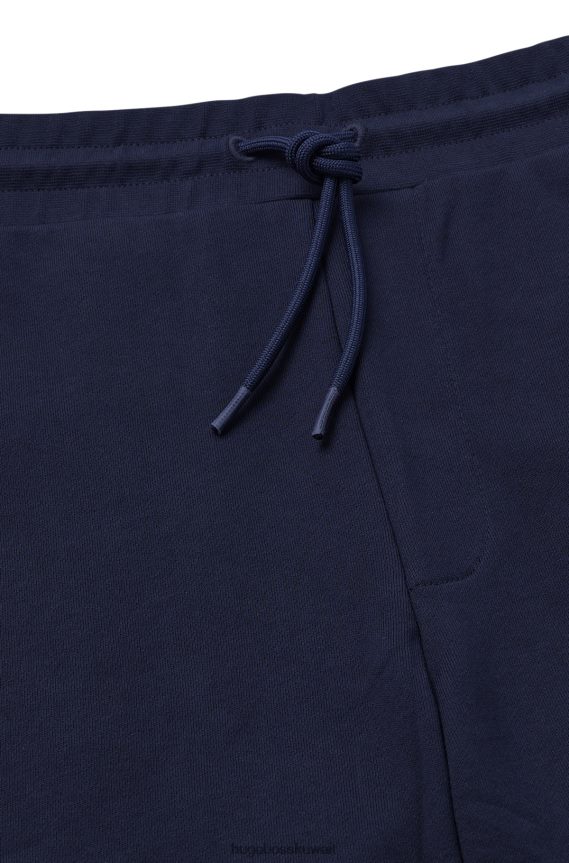 4TFNJN2576 أزرق غامق Hugo Boss بدلة رياضية من قطن تيري مع تفاصيل الشعار باللون الأزرق الداكن