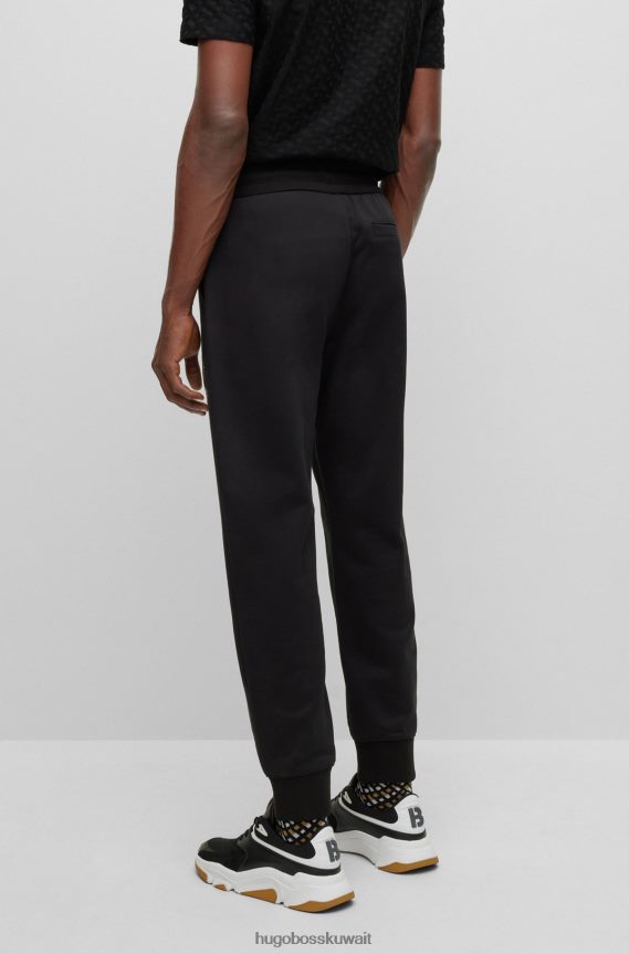 4TFNJN2634 أسود Hugo Boss بدلة رياضية من قطن تيري باللون الأسود من Hugo مع شعار مملوء بالأحرف