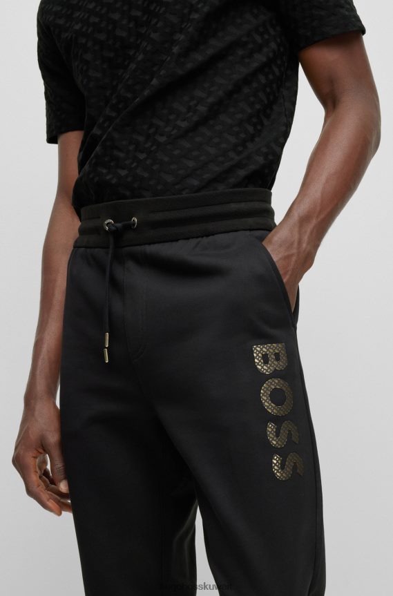 4TFNJN2634 أسود Hugo Boss بدلة رياضية من قطن تيري باللون الأسود من Hugo مع شعار مملوء بالأحرف