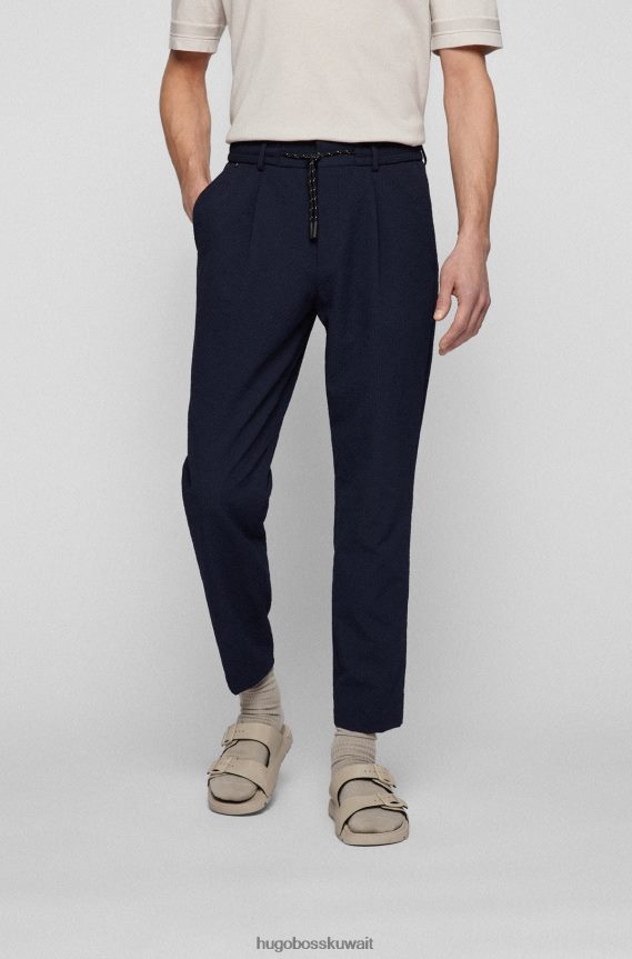 4TFNJN2858 أزرق غامق Hugo Boss بنطال بقصّة مدببة مصنوع من القماش القطني المطاطي باللون الأزرق الداكن