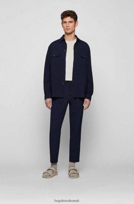 4TFNJN2858 أزرق غامق Hugo Boss بنطال بقصّة مدببة مصنوع من القماش القطني المطاطي باللون الأزرق الداكن