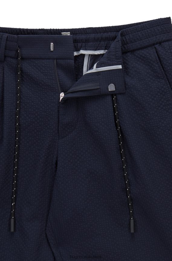4TFNJN2858 أزرق غامق Hugo Boss بنطال بقصّة مدببة مصنوع من القماش القطني المطاطي باللون الأزرق الداكن