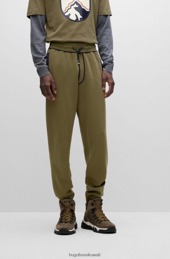 4TFNJN2867 اخضر فاتح Hugo Boss سروال رياضي Hugo ذو المقاس العادي باللون الأخضر الفاتح مصنوع من القطن والصوف البكر