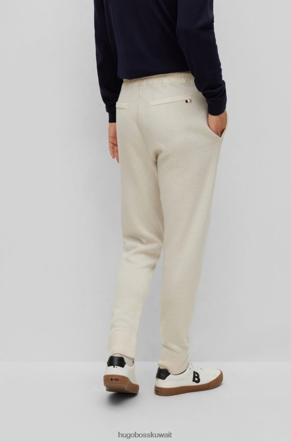 4TFNJN2868 أبيض Hugo Boss هوغو سروال رياضي أبيض بقصة عادية مصنوع من القطن والصوف البكر